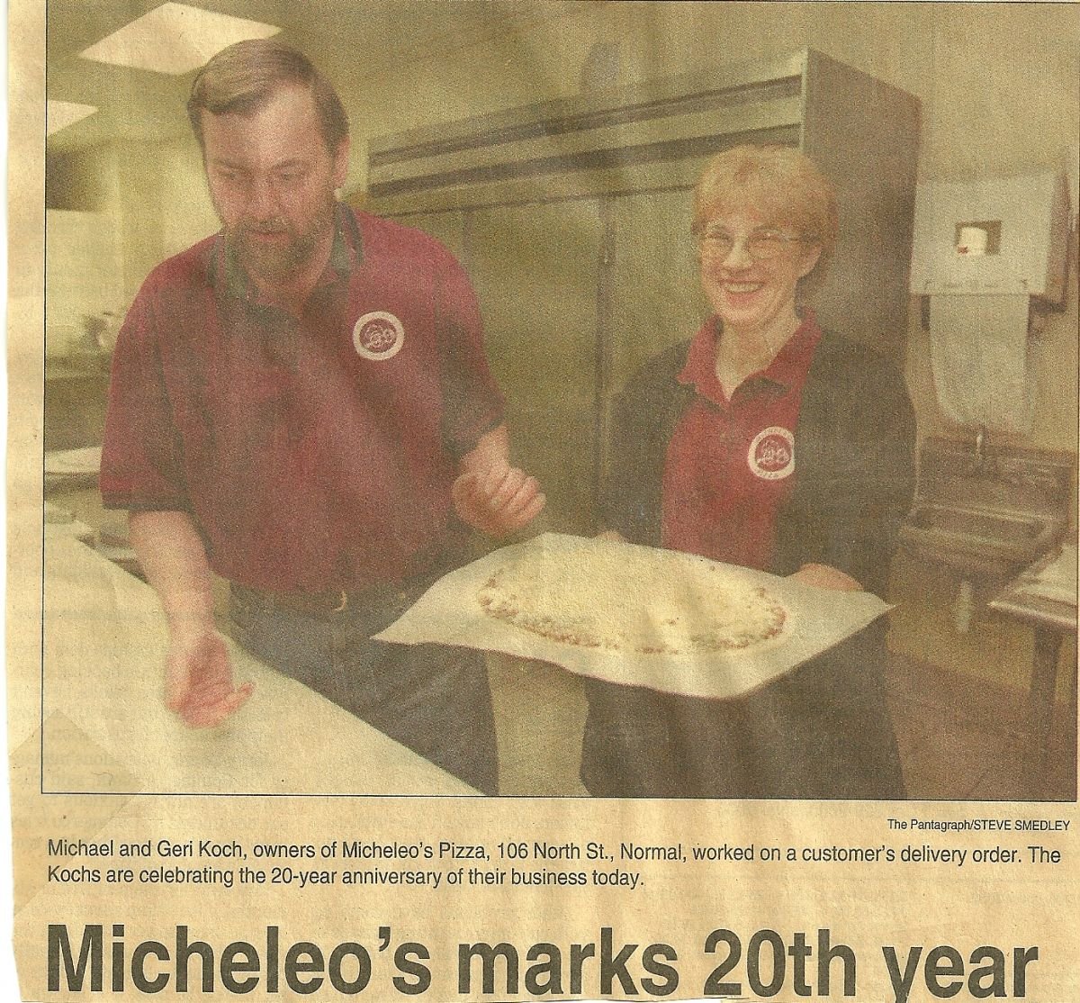 Mike & Geri Koch, owners of Micheleo's Pizza, working on a customer's delivery order.
